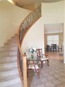 Elegant Foyer with Curved Staircase